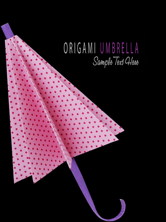Origami pink polka-dot protection umbrella on a black backgroundの写真素材