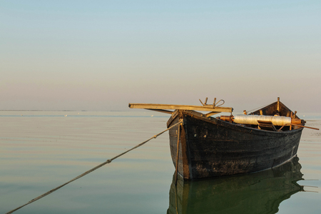 Lake holiday fishing old boat summer sunrice on waterの写真素材