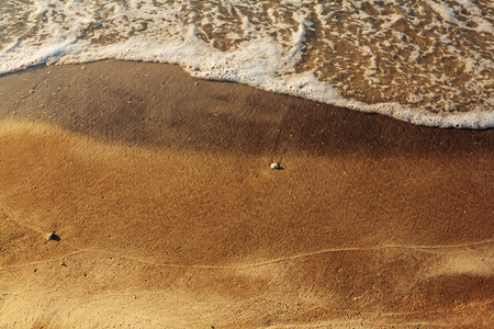 Sand beach with blue wave blank backgroundの写真素材