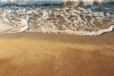 Sand beach with blue wave blank backgroundの写真素材