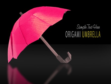 Origami red protection umbrella on a white backgroundの写真素材