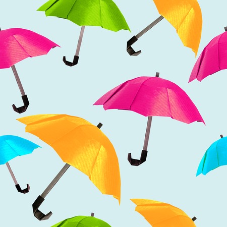 Origami red protection umbrella on a white backgroundの写真素材