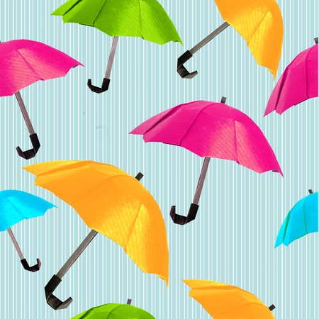 Origami red protection umbrella on a white backgroundの写真素材