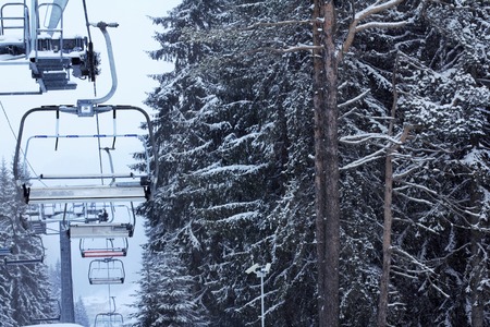Winter forest snow ski lift trace mans on snow backgroundの写真素材