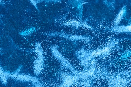 Textured ice blue cold frozen winter backgroundの写真素材