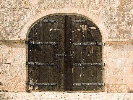 Ancient iron and wooden doorの写真素材
