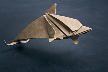 Dolphin origami of kraft paperの写真素材