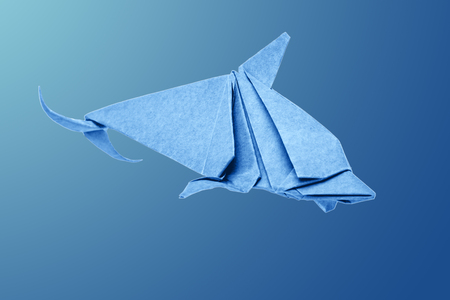 Dolphin origami of paper on a water backgroundの写真素材