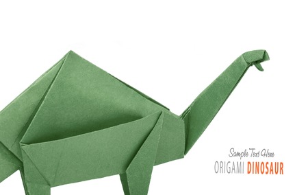 Isolated origami paper green brontosaurus dinosaur on black backgroundの写真素材