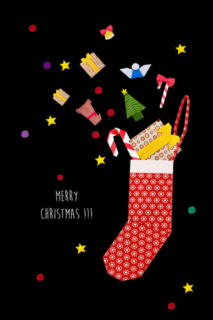 Origami red Christmas sock with presentsの写真素材