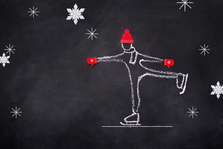 Chelk sketch of child skating on ice rink, Hand drawn illustration on black boardの写真素材