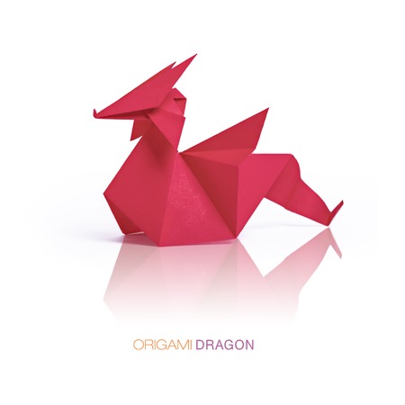 Origami red paper dragonの写真素材