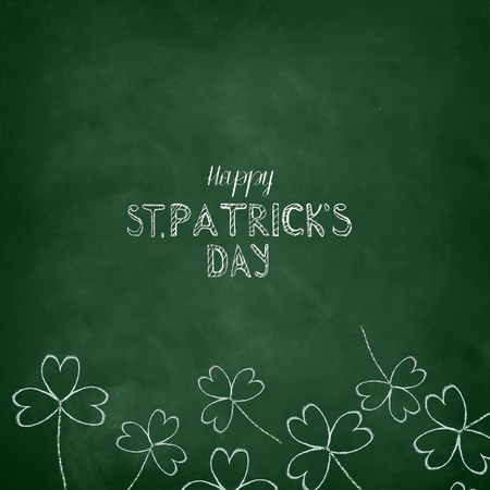 Happy St. Patrick's Day written on a green chalkboardの写真素材