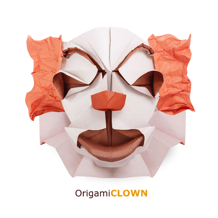 Origami paper clown face isolated on whiteの写真素材