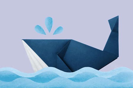 Photo of paper origami marine blue whale in waves on violet backgroundの写真素材