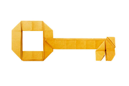Origami paper golden key on a white backgroundの写真素材