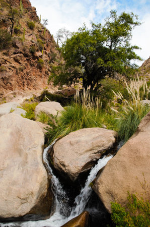 Long shot of a waterfall on the Cascadas del rio Colorado Trek close to Cafayate in Argentina, South...