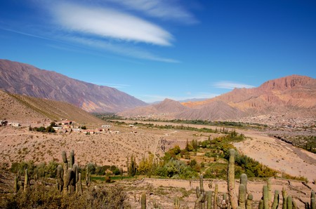 Long shot of the seven color hill or cerro de los siete colores in the village Purmamarca in the canyon quebrada de humahuaca in Jujuy, Argentina, South Americaの写真素材