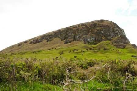 Long shot of Moai statues at the famous Moai statue quarry around the Rano Raraku volcano in Easter Island, Rapa Nui, Chile, South Americaの写真素材
