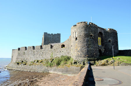 Long shot of Carrickfergus Castle, a Norman Irish castle in Northern Ireland in the County Antrim, on the northern shore of Belfast Loughのeditorial素材