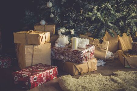 gifts nearby pine tree on christmasの写真素材