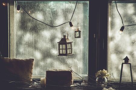 clouds outside window on a christmas day with lighthouse decoration insideの写真素材