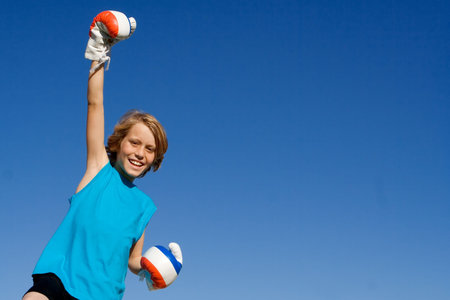 winning child with boxing gloves