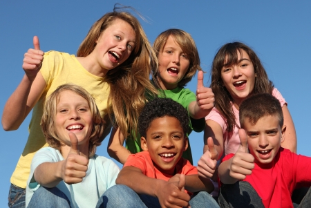 group of diverse kids with thumbs up group of diverse kids with thumbs up