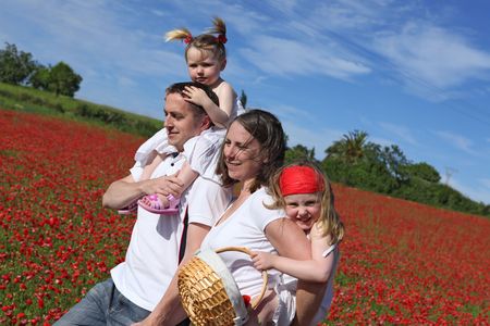 happy familiy walking outdoors in summerの写真素材