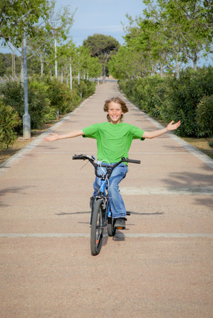 confident child riding bike or bicycleの写真素材