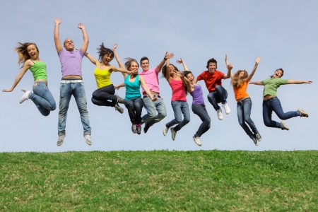 group of teens jumpingat summer camp group of teens jumpingat summer camp