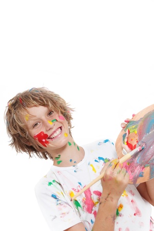 happy child or kid painting with paint and brushの写真素材