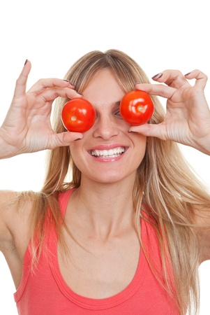 woman with tomatoes for healthy eating conceptの写真素材