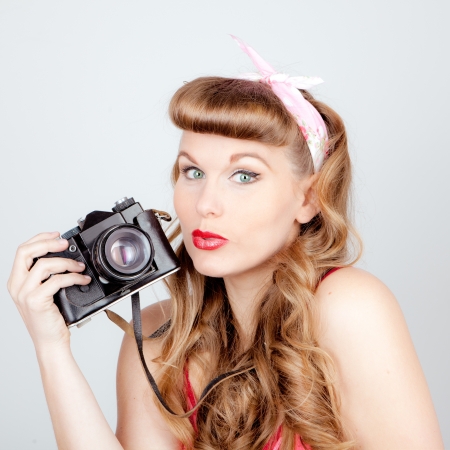 retro woman with analog cameraの写真素材