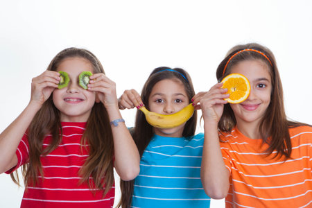 happy kids with healthy diet of fruit.の写真素材