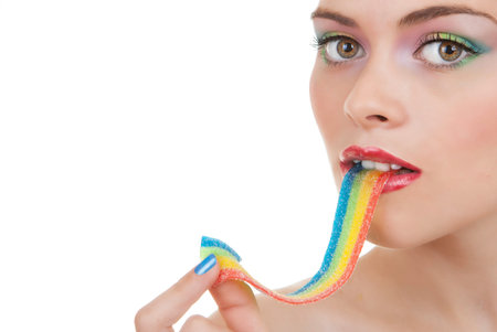 woman with makeup eating sweets or candyの写真素材