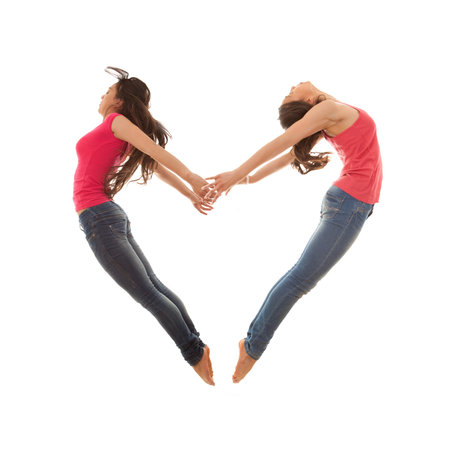 heart shaped women jumpingの写真素材