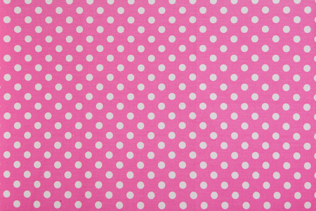 while dots on pink backgroundの写真素材