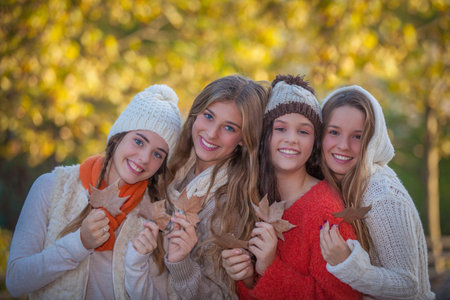 happy smiling autumn or fall friends.の写真素材