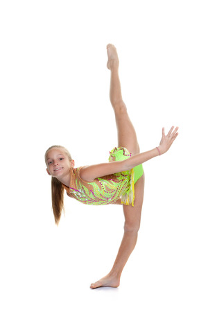 young gymnast training doing splits in air.の写真素材