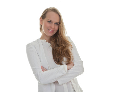 beautiful confident friendly smiling woman with arms foldedの写真素材