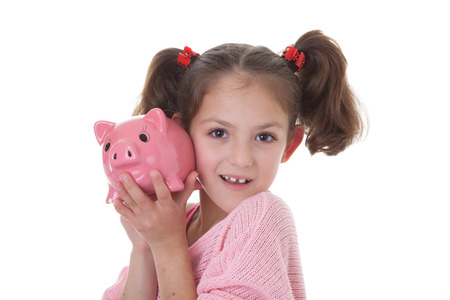 child with savings in piggy bank money boxの写真素材