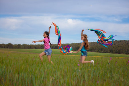 freedom, healthy summer kids running and playing outdoorsの写真素材