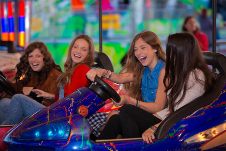 carnival bumper ride group of teens laughingの写真素材