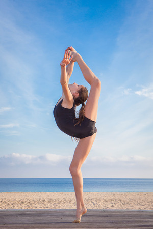 fit healthy young dancer doing stretching poseの写真素材