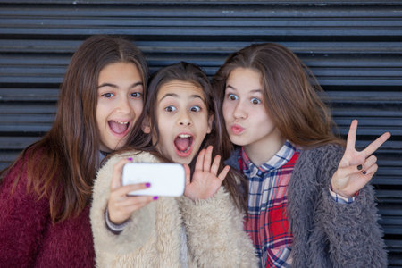 fun kids selfie with cell smart or mobile phone