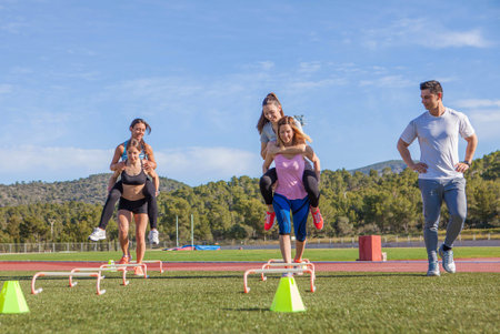 fitness class piggyback race with instructor