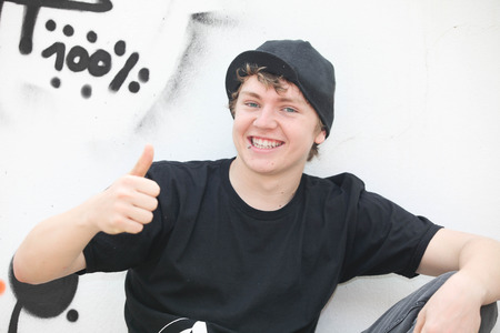 trendy positive teen boy thumbs upの写真素材