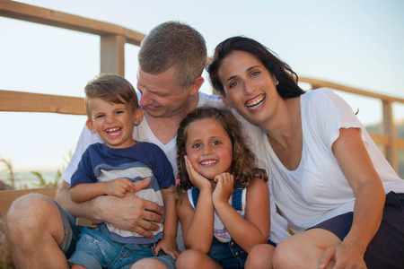happy smiling family on summer vacation parents and kidsの写真素材