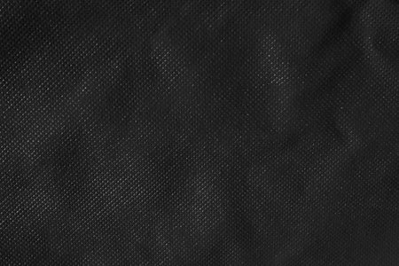 Black synthetic fabric texture background